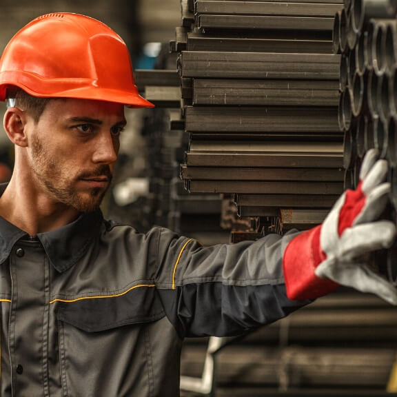 A man inspecting some parts